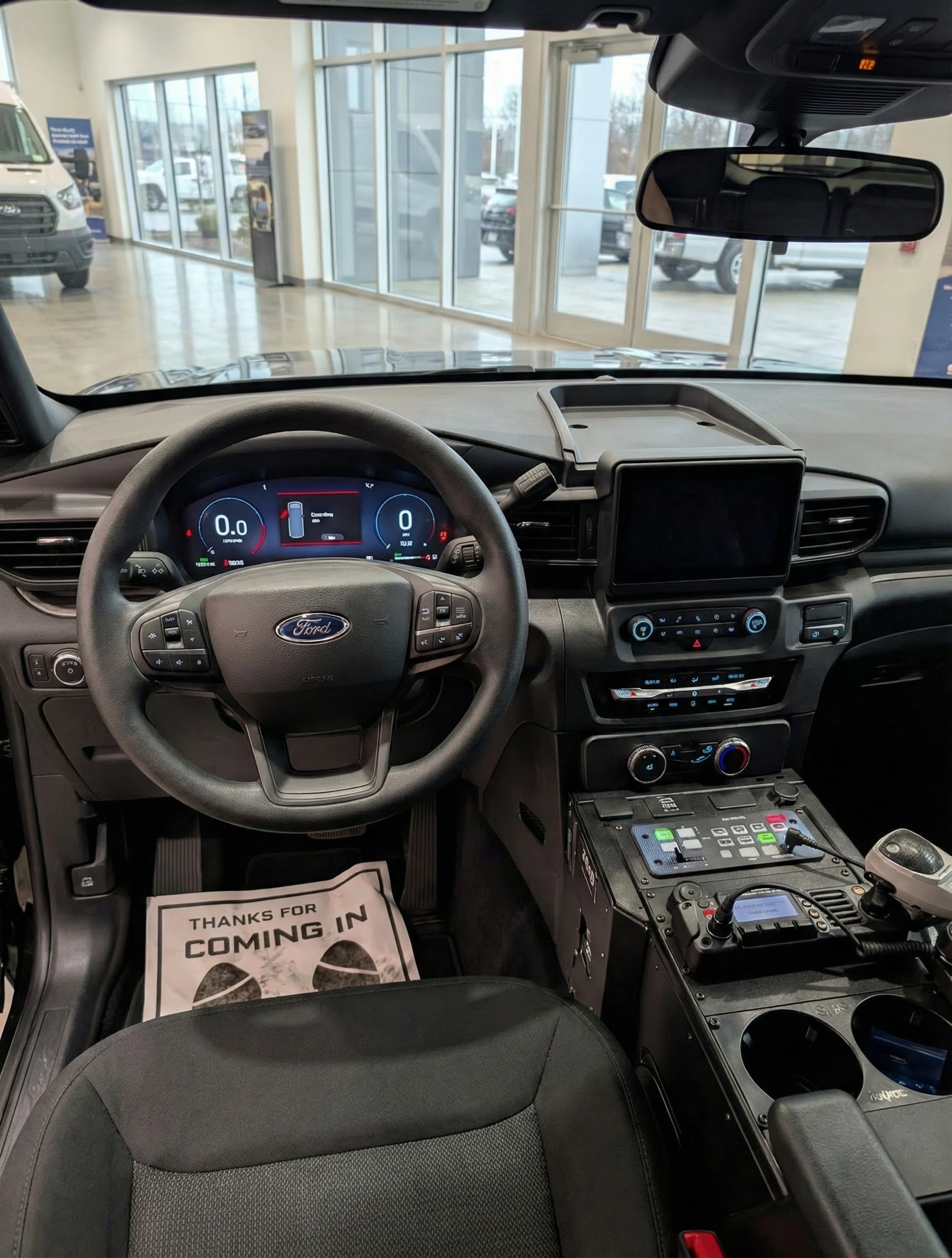 Interior of a Ford Explorer PIU police build with console and equipment