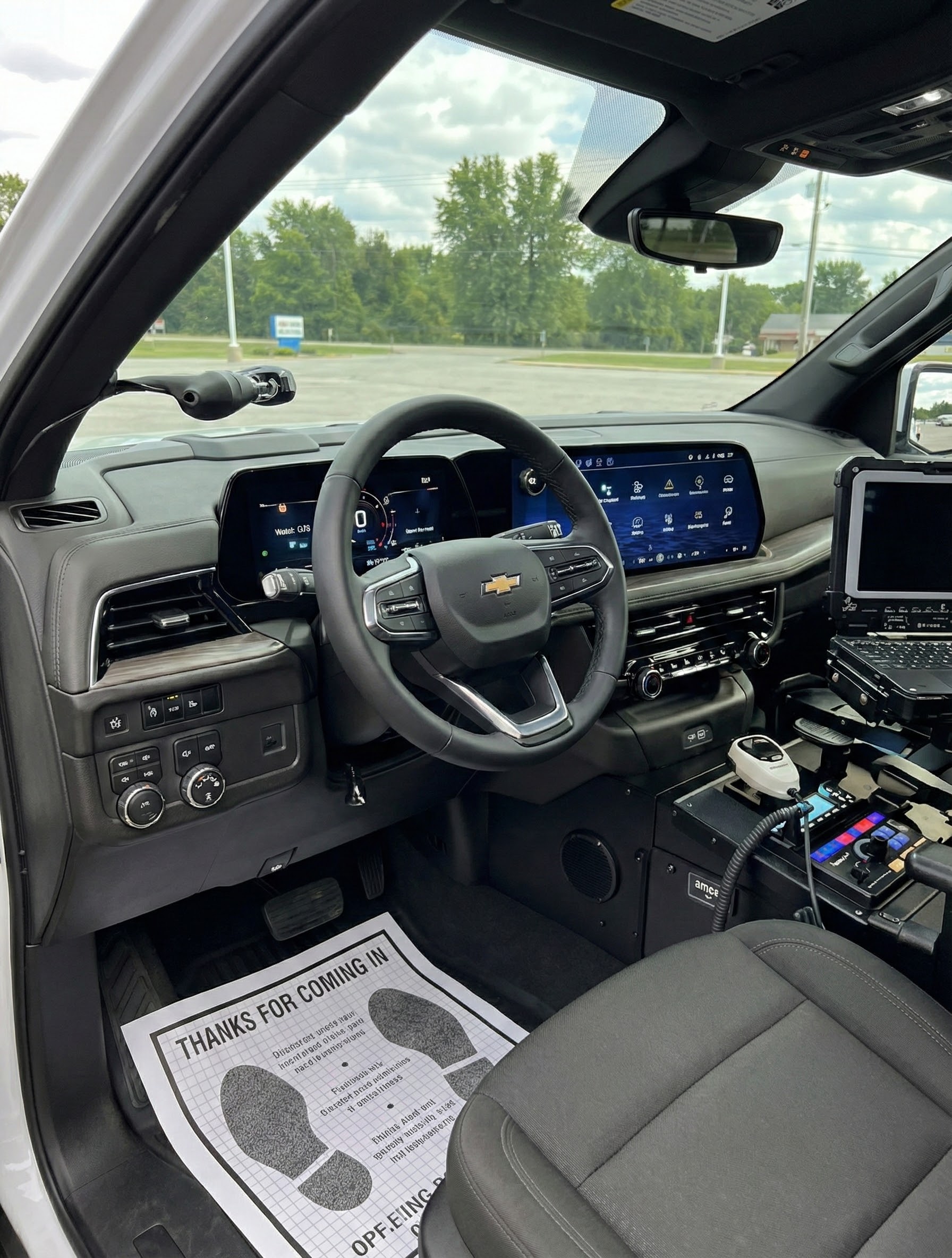 Interior of a Chevy Tahoe SSV police build with console and display